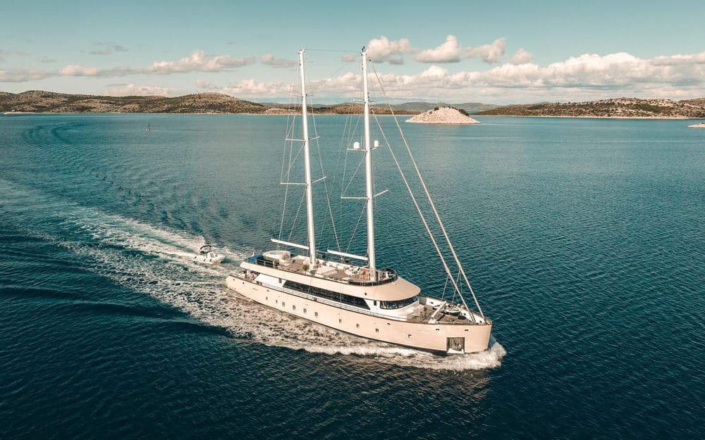A private charter yacht off a quiet coastline
